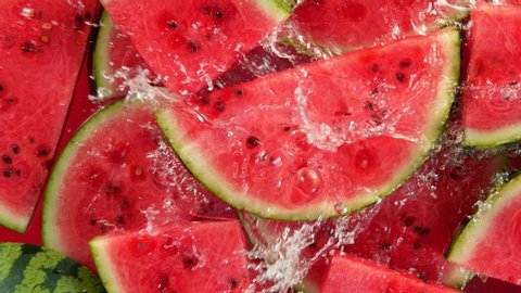 Super Slow Motion Shot of Splashing Water on Fresh Watermelon Slices at 1000fps.