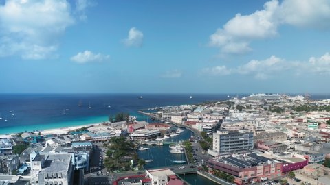 An air drone moves over Bridgetown, Barbados on the sunny day. On the horizon the sea turns into the sky