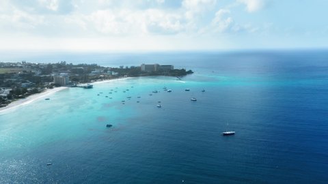 Drone shoots as a boat cuts through the sea among yachts near Bridgetown, Barbados