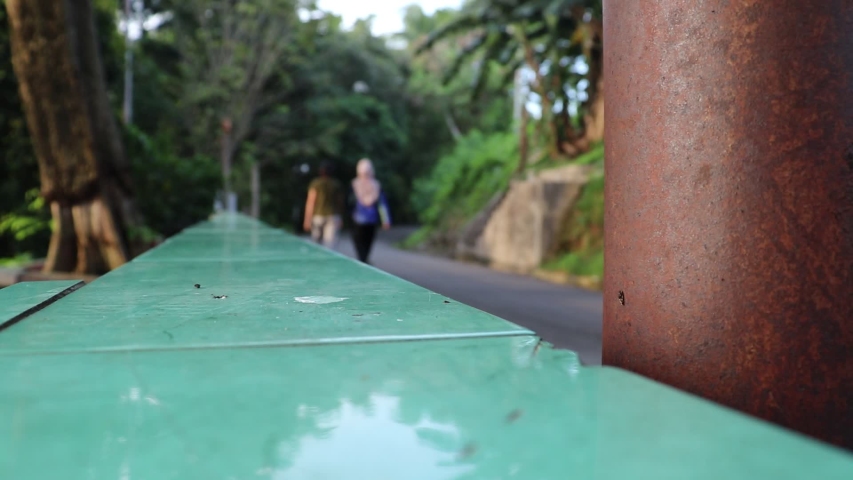 ceramic fence with a background of blur people who are sporting the afternoon gurindam park, tanjungpinang, riau islands, indonesia