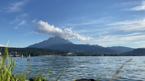 Time Lapse shot of Lake Lucerne and Mount Pilatus with stand up paddle board in Switzerland. High quality Full HD footage