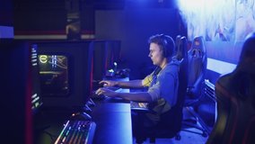 Upset and disappointed Man Playing and losing in Online Video Game in modern esport cybersport club