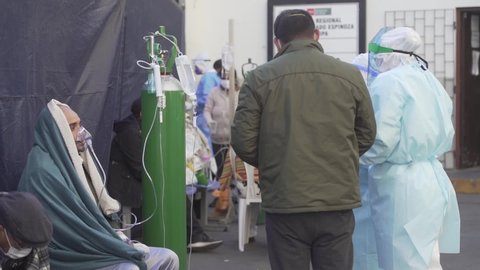 AREQUIPA, PERU - JULY 21 2020.  
Covid-19 patients are treated outside the emergency area of ​​the Honorio Delgado Hospital, collapsed by the large number of people infected in Peru
