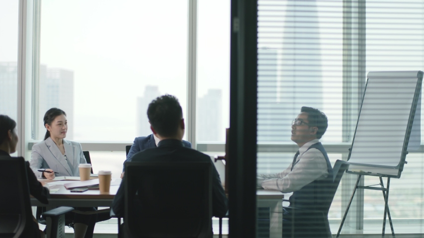 Group of corporate executives meeting in conference room of modern corporation | Shutterstock HD Video #1056845627