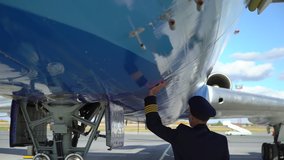 Professional male pilot capitan in uniform on background modern air craft in airport, passenger liner plane aircraft crew, travel flying people aviator. Civil commercial aircrew Airplane flight - Powered by Shutterstock - Get 15% off with code: PIKWIZARD15
