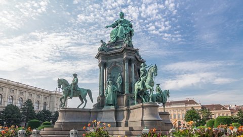Empress Maria Theresia Monument timelapse hyperlapse and Museums Quartier on a background in Vienna, Austria. Famous Natural History Museum with park and sculptures near in Vienna, Austria