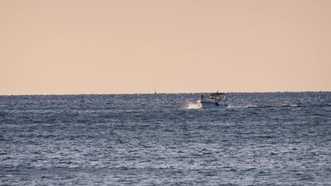 Santa Pola, Spain - December 18, 2019: Trawler fishing boat sailing in sea waters.
