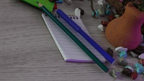 Office and school supplies on wooden table background.