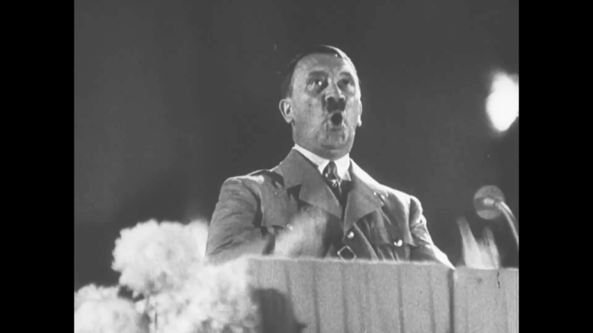 CIRCA 1940 - In this documentary directed by Frank Capra, Hitler, Goebbels and other Nazi officials address an excited crowd.