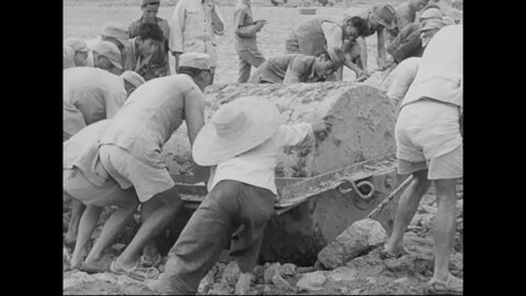 CIRCA 1938 - In this Frank Capra documentary, Chinese men and women build the Burma Road using antiquated tools (narrated in 1944).
