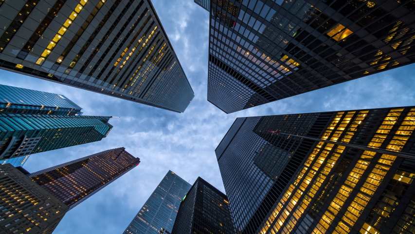 Business and finance concept, moody time lapse view looking up at modern office building architecture in the Toronto financial district, Ontario, Canada. | Shutterstock HD Video #1056881564