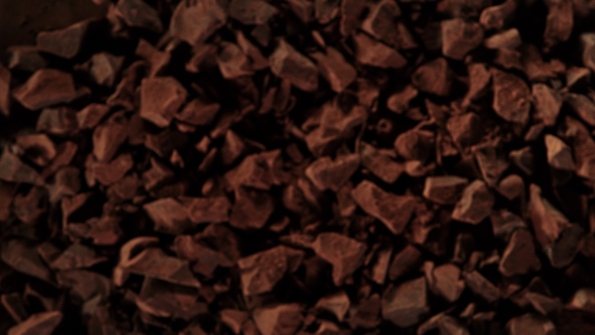 Super Slow Motion Shot of Raw Chocolate Chunks and Cocoa Powder after Being Exploded at 1000fps. | Shutterstock HD Video #1056886727