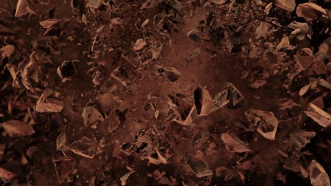 Super Slow Motion Shot of Raw Chocolate Chunks and Cocoa Powder after Being Exploded at 1000fps.