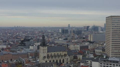 Brussels Belgium Aerial  Flying over Marollen district with church and downtown cityscape views - December 2019