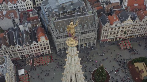 Brussels Belgium Aerial  Birdseye view flying around Saint Michel statue in Grand Place - December 2019