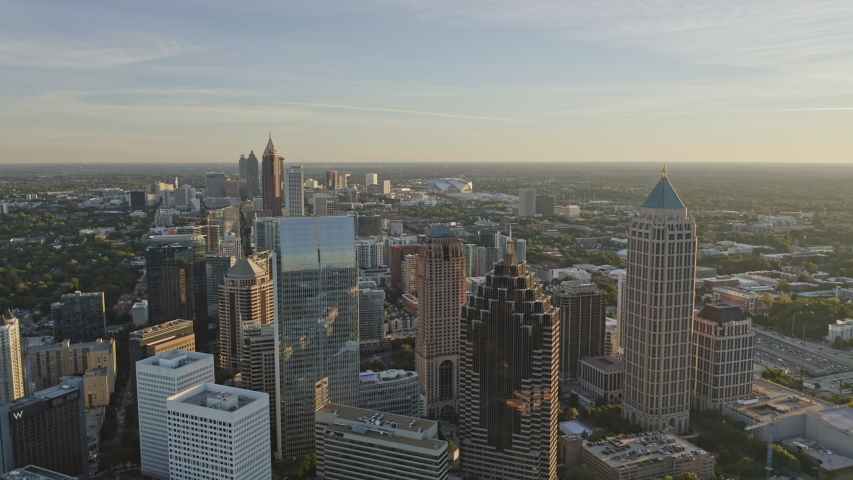Atlanta Aerial  Traversing at an angle from Midtown through Old Fourth Ward district with Downtown skyline cityscape - December 2018