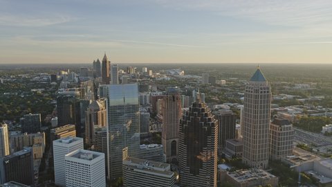 Atlanta Aerial  Traversing at an angle from Midtown through Old Fourth Ward district with Downtown skyline cityscape - December 2018