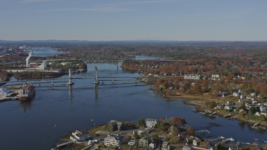 Portsmouth New Hampshire Aerial  Short panning bridge and river cityscape - November 2019