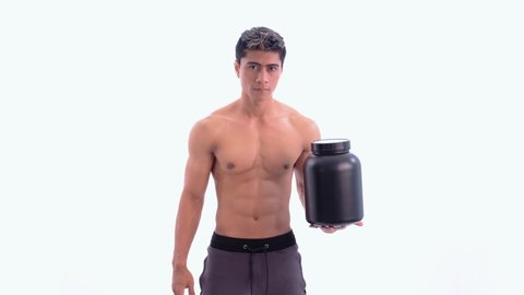 asian young man with muscular body carry a black bottle with one hand while present it stand facing forward and look to camera on isolated background