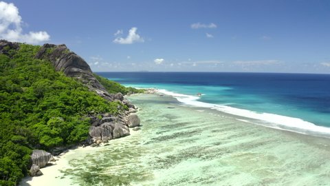 Dron view Anse source d'argent azure sea water (Indian Ocean), La Digue, Seychelles islands vacation, UHD 4K part 4