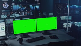 Two Digital Computer Screens with a Green Mock Up Chromakey in Modern Monitoring Office. Control Room with Specialists and Managers Sit in Front of Computers. - Powered by Shutterstock - Get 15% off with code: PIKWIZARD15