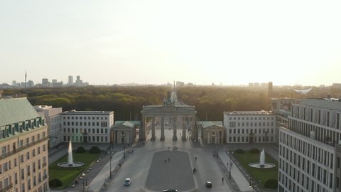 AERIAL: Brandenburger Tor with almost no People in Berlin, Germany due to Coronavirus COVID 19 Pandemic in Beautiful Sunset Light
