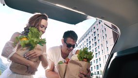 Young Joyful Couple Together Unloads, Closes Car Trunk, Carries Food Packages After Shopping in Grocery Store. Funny Purchases, Real Happy Relationship, Modern Lifestyle of Two Excited Friends Outdoor - Powered by Shutterstock - Get 15% off with code: PIKWIZARD15