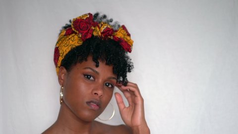 Black woman wearing traditional African headscarf portrait
