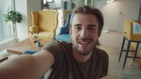 man during video conference call on the phone, video chat with friends, happy man on lockdown, POV camera view, talking young freelancer, family and social distance.
