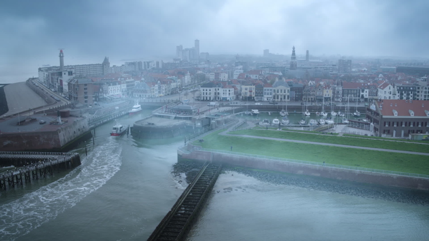 Aerial shot over foggy seaside town