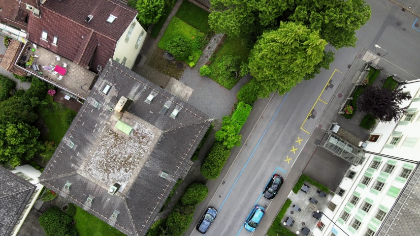 Aerial cinematic shot tilting up to reveal Glarus main church in Switzerland