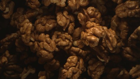 Walnut Nuts Thrown in the Air in High Speed Flying on Black Background 4k