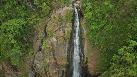 Dramatic aerial pull out shot of the Sana Muerto Waterfall. Orocovis Puerto Rico