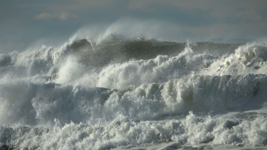 Extreme Ocean Wave. Power of waves breaking splashing sea-spray water foam  Royalty-Free Stock Footage #1056937631