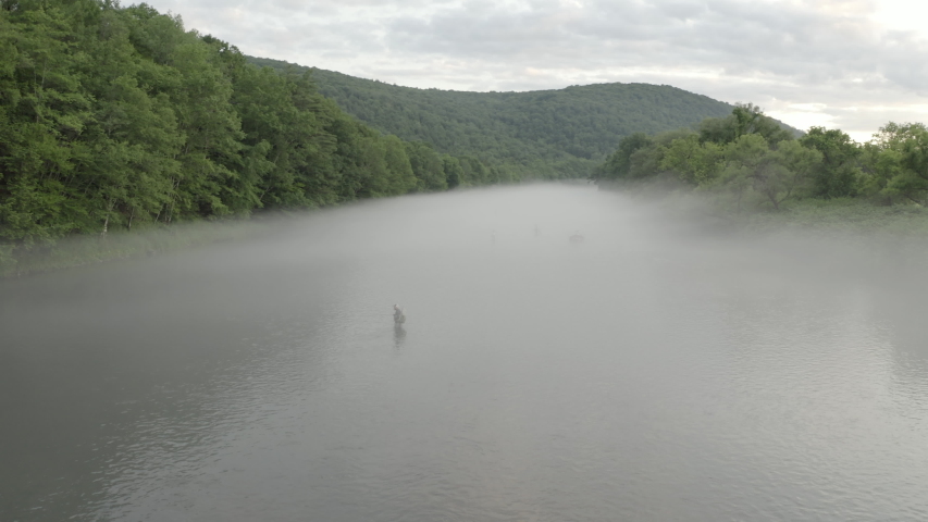 Drone Fly By Footage of Fly Fishing in Foggy weather
