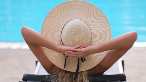 traveler tourist bikini woman in hat relaxing vacation happy holiday at luxury hotel tropical resort swimming pool. enjoying summer spa travel tourism beach ocean lifestyle outdoors slow-mo, 4 K