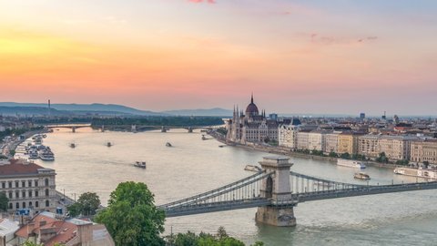 Budapest Hungary time lapse 4K, city skyline day to night timelapse at Danube River with Chain Bridge and Hungarian Parliament