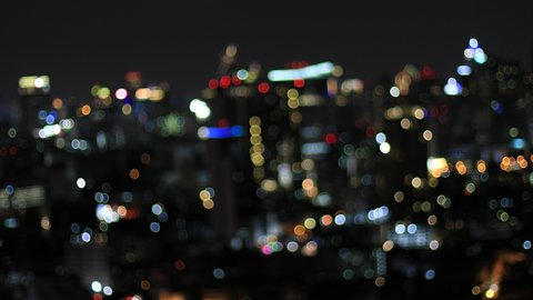 Abstract Bokeh of big city lights at night.  Blurry background of bangkok city, Thailand use for background.
