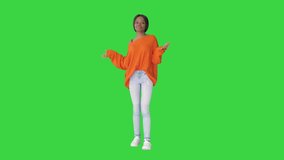 Young casual african woman dancing on a Green Screen, Chroma Key. - Powered by Shutterstock - Get 15% off with code: PIKWIZARD15
