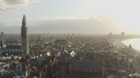 Antwerp Belgium Aerial Flying over downtown with old town cityscape views at sunset - November 2019