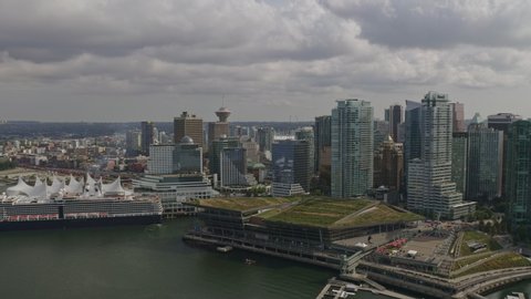 Vancouver BC Canada Aerial Panning from Coal Harbour district to Stanley Park with cityscape views - August 2019