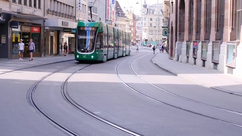 BASEL, SWITZERLAND, JULY 2020: tram runs through the streets of Basel, tourist, historical concept, modern transport of European cities