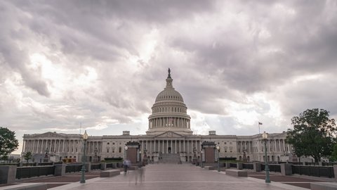 A timelapse of the U.S. Capital with dramatic clouds above.