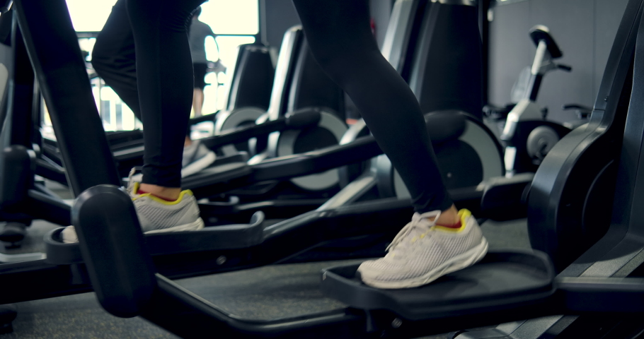 A member of a gym Come exercise by running on a treadmill. People in the gym are exercising by running. Concept of exercising in the gym. fitness gym, fitness exercise, exercise lose weight. Royalty-Free Stock Footage #1057002092
