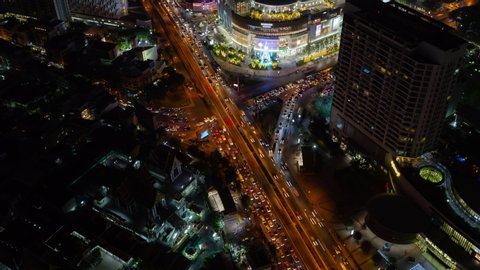 Timelapse of aerial view of Bangkok city and road traffic at night time