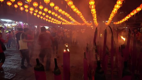 George Town, Penang / Malaysia - Jan 24 2020: Devotees burn the dragon joss stick at temple during chinese new year.