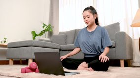 Woman yoga in the living room of your home. Exercise at home.