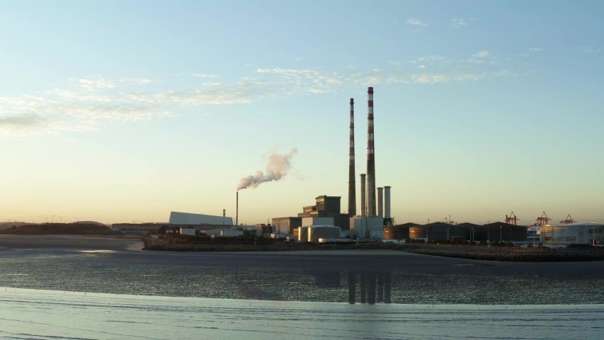 Aerial of Poolbeg Beach in the evening, power plant in background