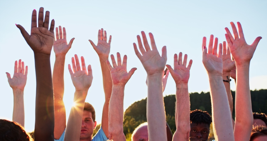 Close up of volunteers' hands of mixed races and different ages. A group of happy eco activists putting, raising hands up to the sky. Friendship, teamwork, volunteering concept. | Shutterstock HD Video #1057037069