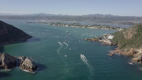 Aerial: Motorboats pass the Heads to enter picturesque Knysna Lagoon